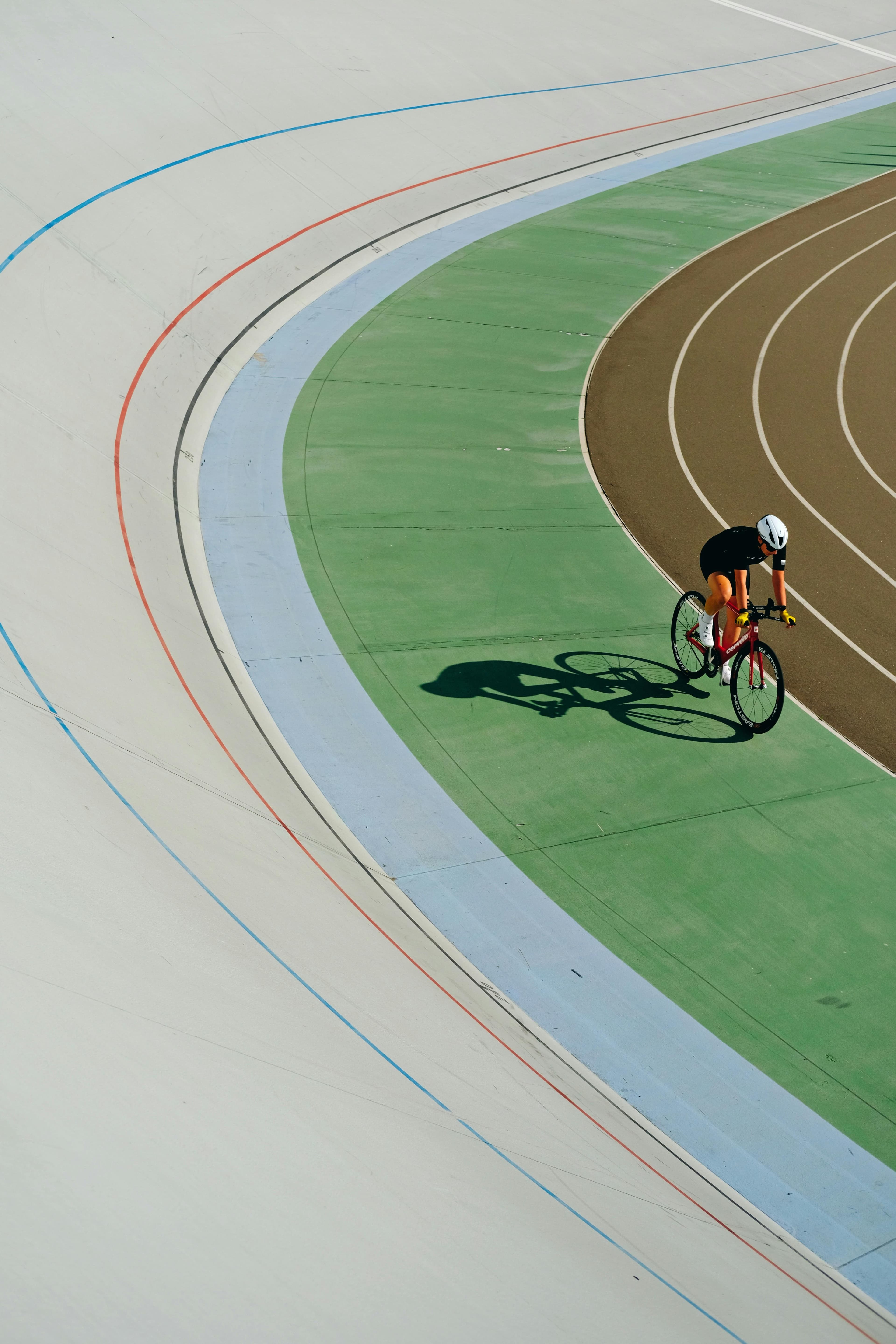 Track cyclist representing a guided performance-focused bike fit journey.